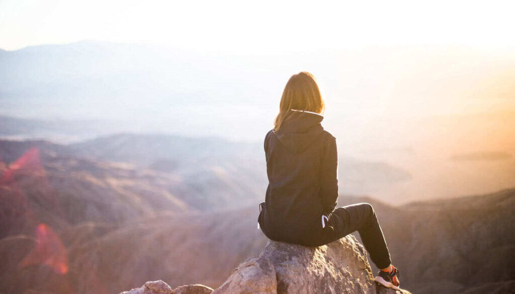 girl-at-top-of-mountain